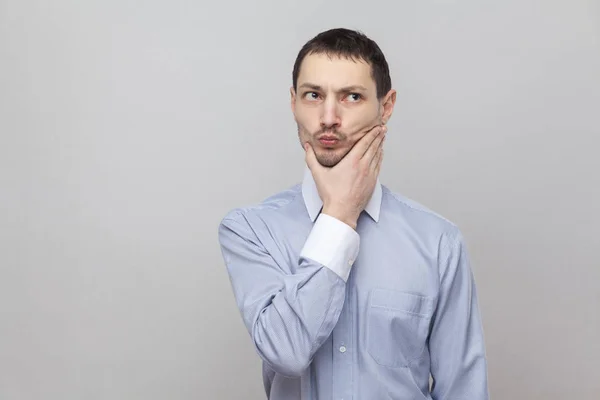 Portrait Thoughtful Businessman Touching His Chin Looking Away Grey Background — Stock Photo, Image