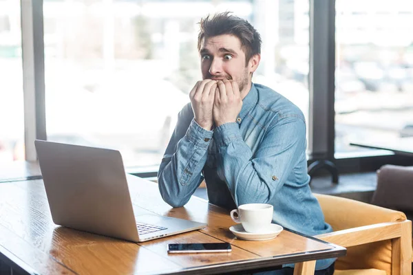 Portrait Emotional Nervous Businessman Blue Jeans Shirt Sitting Cafe Biting — Stock Photo, Image