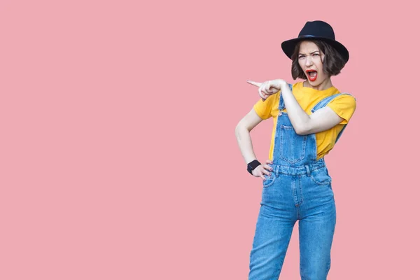 Portrait Amazed Beautiful Woman Yellow Shirt Blue Denim Overalls Makeup — Stock Photo, Image