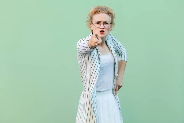 Serious Young Blonde Woman White Striped Blouse Eyeglasses Looking Pointing — Stock Photo, Image