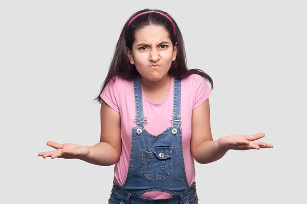 Confused Brunette Young Girl Pink Shirt Blue Overalls Standing Raised — Stock Photo, Image