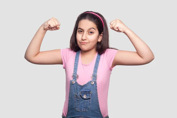 Satisfied Brunette Young Girl Pink Shirt Blue Overalls Standing Raised — Stock Photo, Image