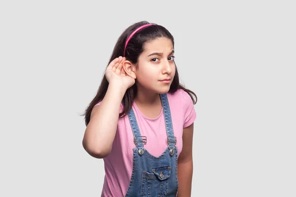 Attentive Brunette Young Girl Casual Pink Shirt Blue Denim Overalls — Stock Photo, Image
