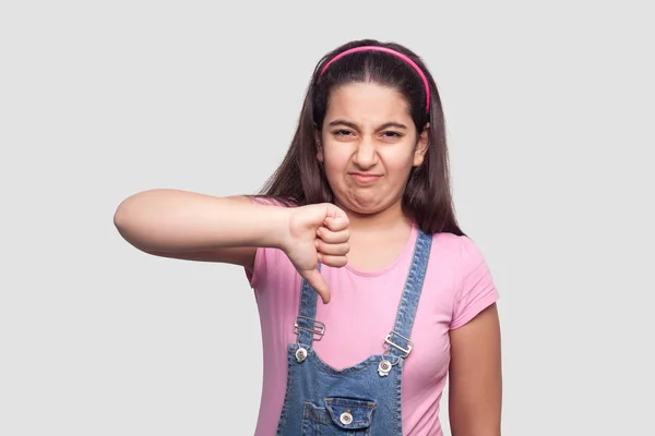 Displeased Sad Brunette Young Girl Pink Shirt Blue Overalls Looking — Stock Photo, Image