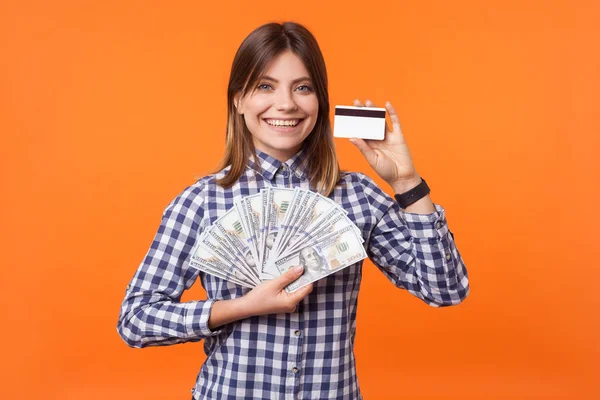 Portrait of happy rich brunette woman in checkered shirt holding — Stock Photo, Image
