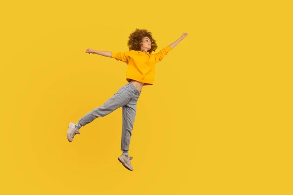 Portrait Superhero Curly Haired Girl Urban Style Outfit Flying Raised — Stockfoto