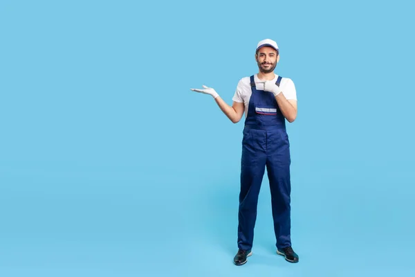 Full Length Cheerful Worker Blue Overalls Cap Protective Gloves Standing — Zdjęcie stockowe