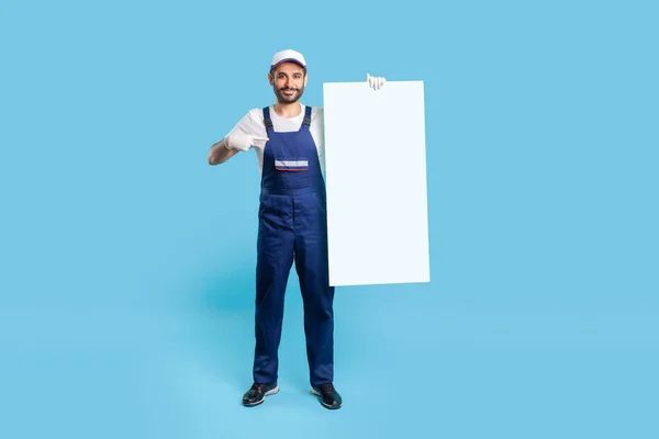 Full Length Happy Labourer Man Uniform Protective Gloves Pointing Vertical — Zdjęcie stockowe