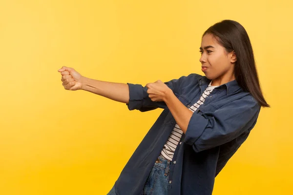 Portrait Diligent Purposeful Girl Denim Shirt Pulling Invisible Heavy Burden — Φωτογραφία Αρχείου