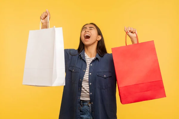 Portrait Overjoyed Shopper Girl Stylish Denim Shirt Raising Bags Shouting — Stock Photo, Image
