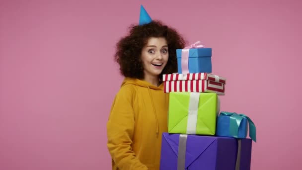 Delighted Joyful Girl Afro Hairstyle Funny Cone Hat Holding Mount — Stock Video