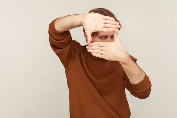 Portrait Creative Man Casual Sweatshirt Looking Hand Frame Gesture Cropping — Stock Photo, Image