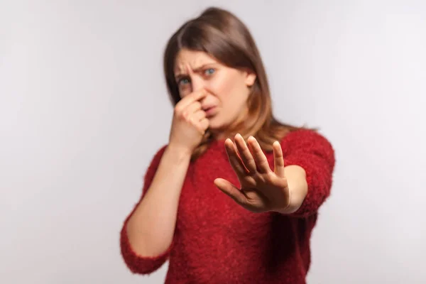 Portrait Girl Grimacing Disgust Pinching Her Nose Showing Stop Hand — Stock Photo, Image