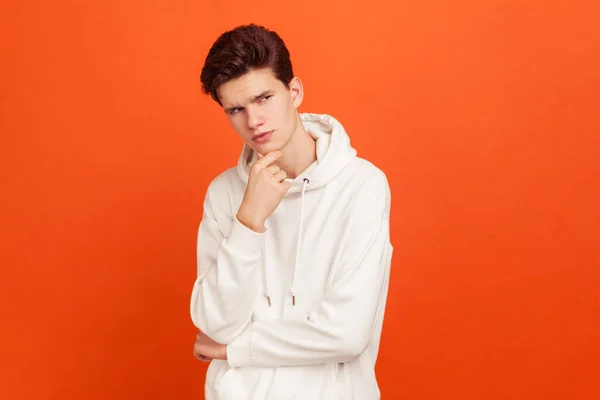 Thoughtful Young Man Casual Sweater Hood Holding His Chin Thinking — Stock Photo, Image