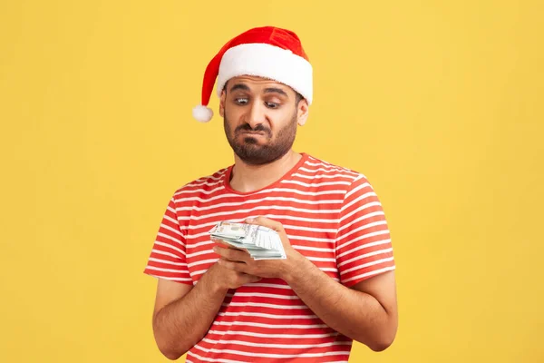 Unhappy Confused Bearded Man Santa Claus Hat Holding Dollars Hands — Stock Photo, Image