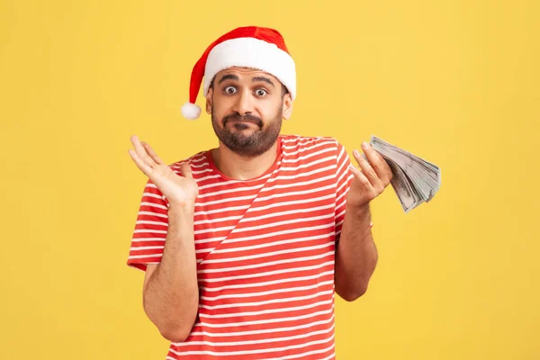 Puzzled Confused Man Beard Red Santa Claus Hat Holding Cash — Stock Photo, Image