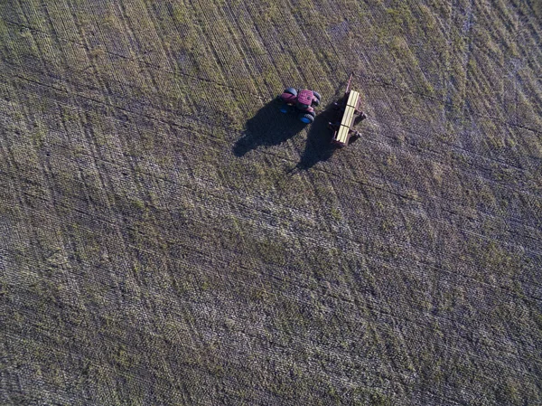 Aerial view of Tractor and seeder, direct sowing in pampa, Argentina