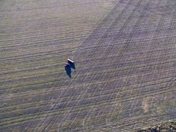Aerial view of tractor and seeder, direct sowing in pampa region, Argentina