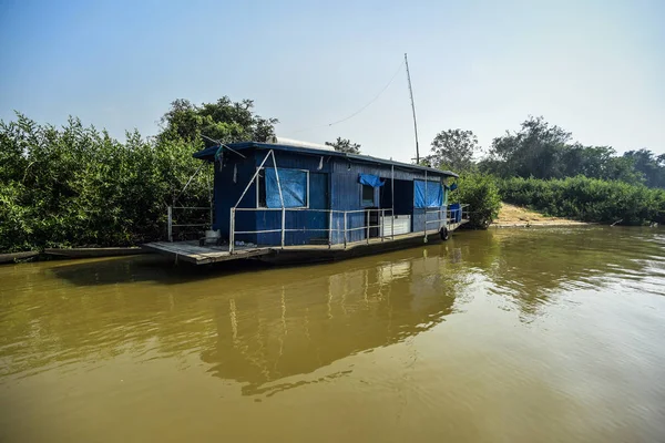 River landscape, home boat  and jungle, Pantanal, Brazil