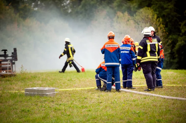 Germany, Baden Wurttemberg, Niederstetten. September 2019. Young firefighters in training. — Stock Photo, Image