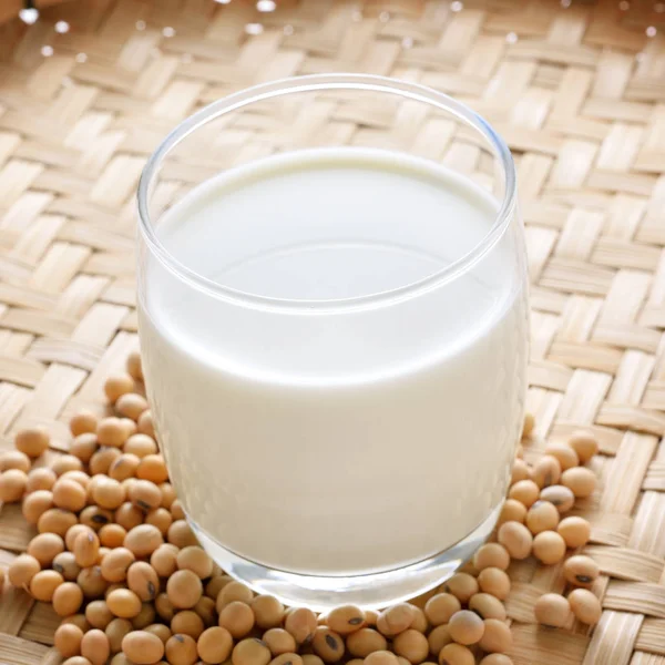 soy milk with soy beans background