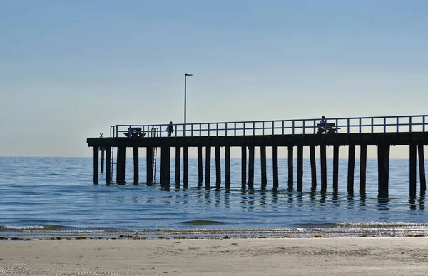 Distant view of beach pier in afternoon — Stock Photo, Image