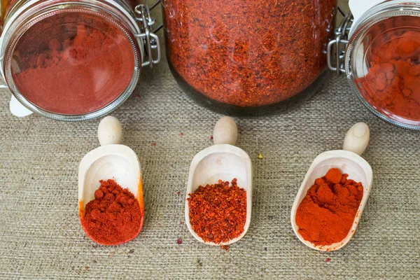 Smoked Hot Paprika Sweet Paprika Chopped Paprika Wooden Scoops Jars — Stock Photo, Image