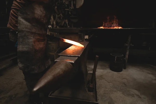 Blacksmith Examining Hot Metal Rod Workshop — Stock Photo, Image