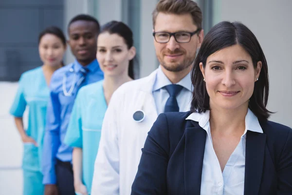 Portrait Smiling Doctors Standing Row Hospital Premises — Stock Photo, Image