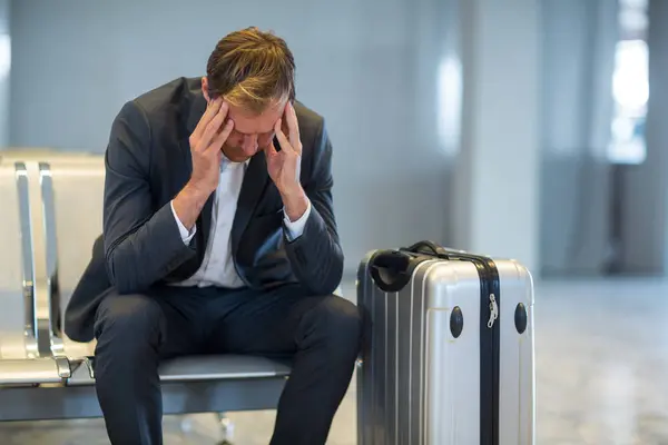 Tense Businessman Sitting Waiting Area Luggage Airport Terminal — Stock Photo, Image