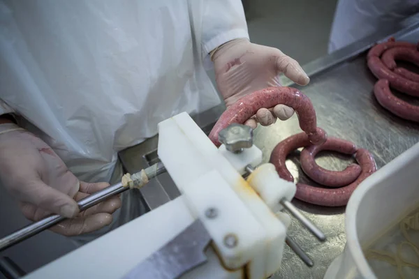 Mid Section Butcher Processing Sausages Meat Factory — Stock Photo, Image