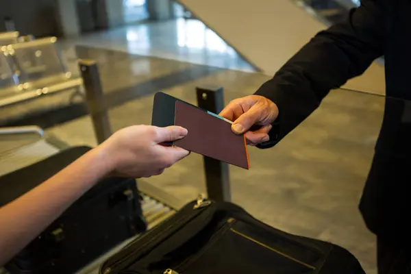 Female Airport Staff Giving Boarding Pass Passengers Airport Terminal — Stock Photo, Image