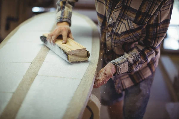 Mid Section Man Using Sanding Block Surfboard Workshop — Stock Photo, Image