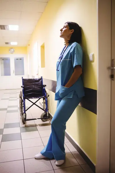 Depressed Nurse Standing Hospital Corridor — Stock Photo, Image