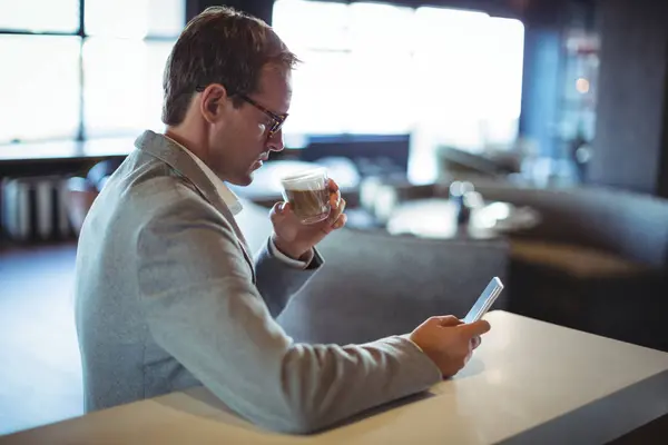 Businessman Using Mobile Phone While Having Coffee Cafe — Stock Photo, Image