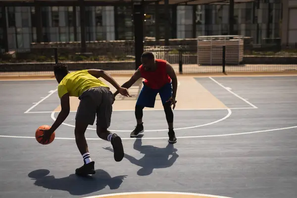 Rear View African American Basketball Player Dribbling Another African American — Stock Photo, Image