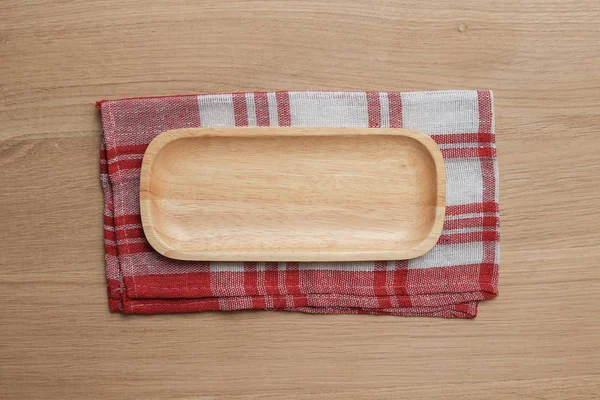 wooden table top with Kitchen ware for the background