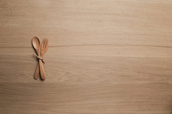 wooden table top with Kitchen ware for the background