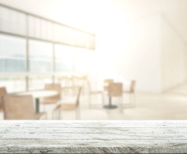 Arka plandaki masa üstü ve bulanık restoran