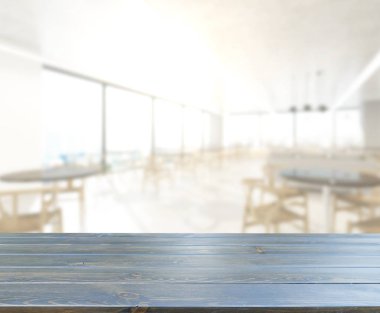 Arka plandaki masa üstü ve bulanık restoran