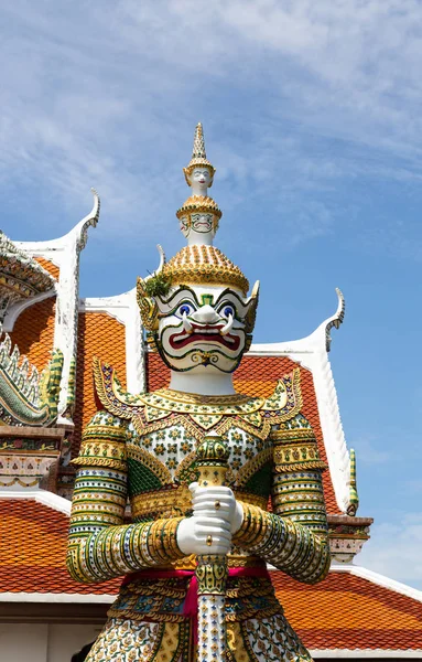 Giant,demon guardian statues decorating the buddhist temple Wat Arun or Wat Arun Ratchawararam Ratchawaramahawihan in Bangkok,Thailand