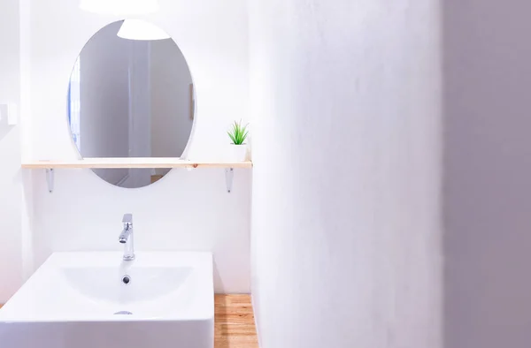 White sink and mirror hanging above them,wood counter, wooden shelf,white wall bedroom interior modern design — Stock Photo, Image