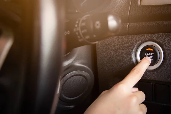 Close up finger pressing the engine start/stop button of a car,car driver stating the engine — Stock Photo, Image