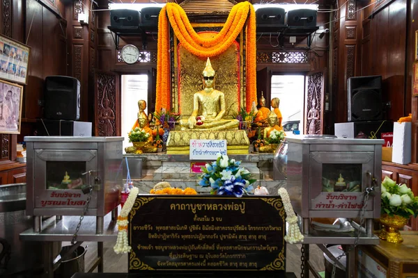 Samut Sakhon,Thailand-May 13,2019:Unseen Thailand,the ancient golden buddha statue wearing black glasses with dark lenses or sunglasses,is a place and sacred buddha image that is popular with local people at Wat Krok Krak,travel in Samut Sakhon — Stock fotografie