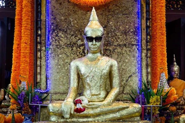 Samut Sakhon,Thailand-May 13,2019:Unseen Thailand,the ancient golden buddha statue wearing black glasses with dark lenses or sunglasses,is a place and sacred buddha image that is popular with local people at Wat Krok Krak,travel in Samut Sakhon — Φωτογραφία Αρχείου