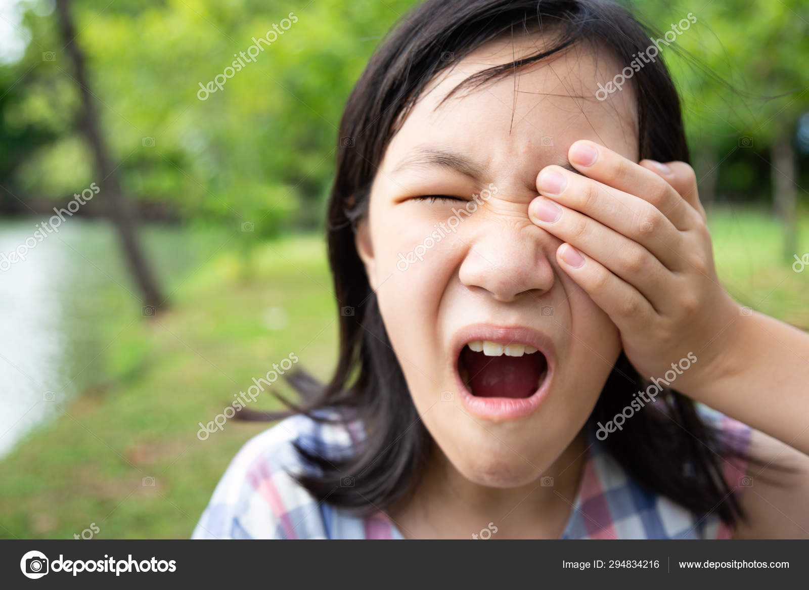 Asian little child girl patient painful,sore eyes,touching ...