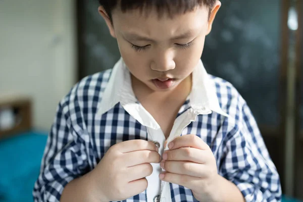 Hand Little Child Trying Wear Shirt Asian Student Buttoning His — стоковое фото