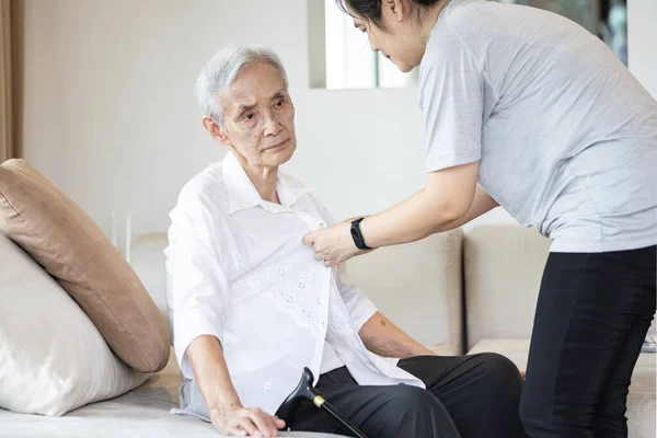 Asian Granddaughter Taking Care Helping Senior Grandmother Get Dress Button — Stock Photo, Image