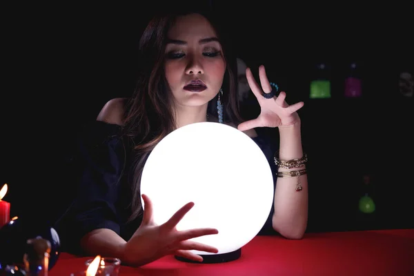 Fortune teller forecast future event or destiny by using crystal ball.