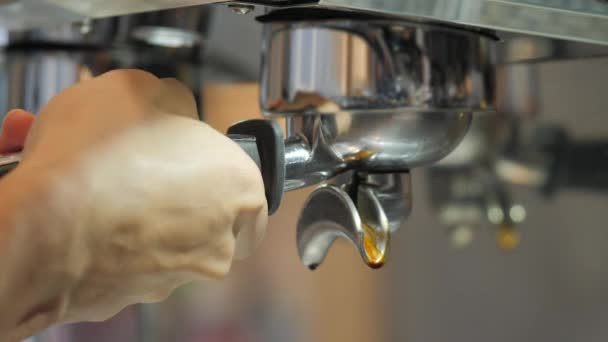 Making Fresh coffee going out from a coffee espresso machine. Shoot on Digital Cinema Camera in slow motion — Stock Video